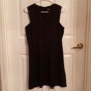 Sleeveless black dress.